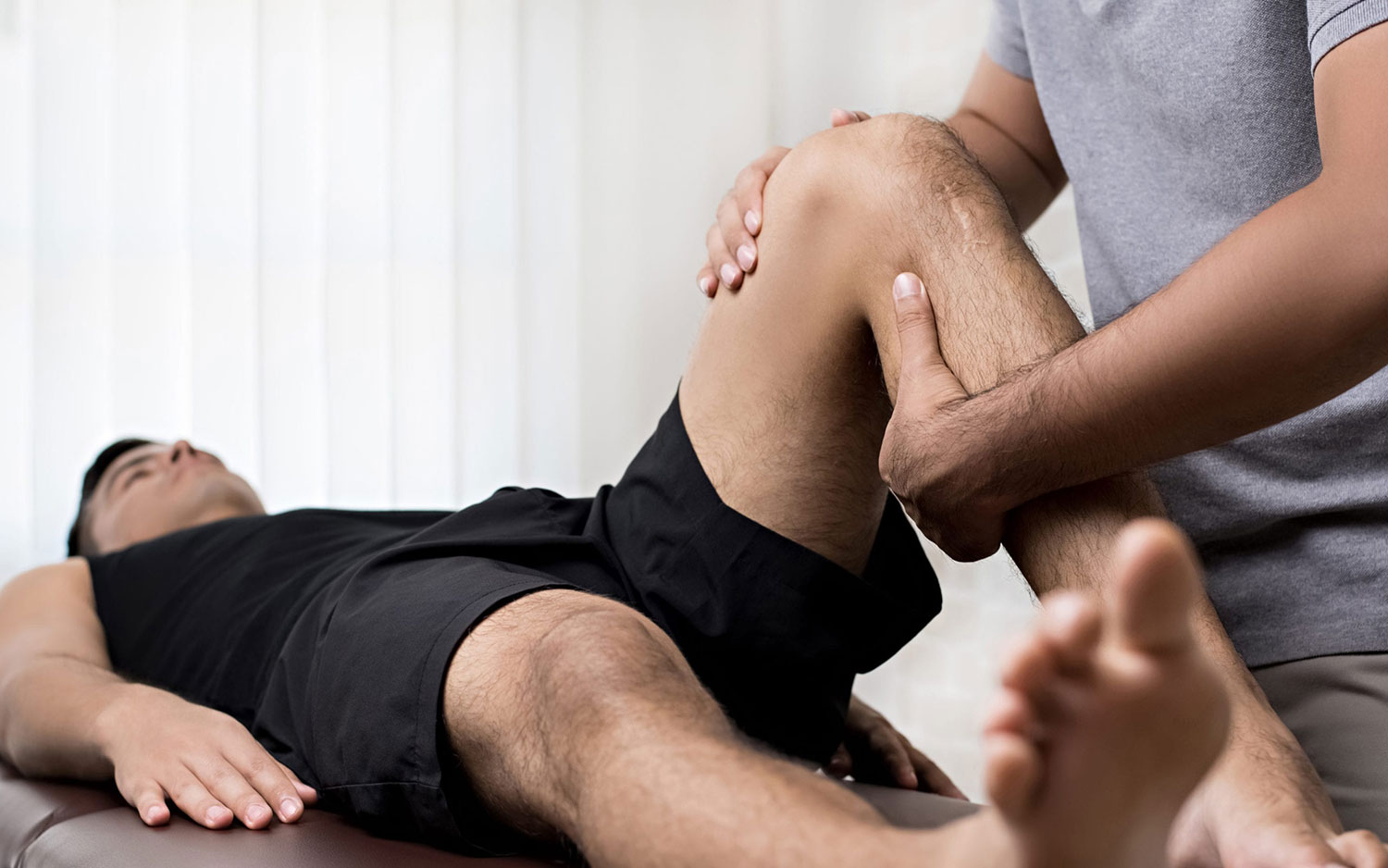 A Genesis therapist working directly with a patient